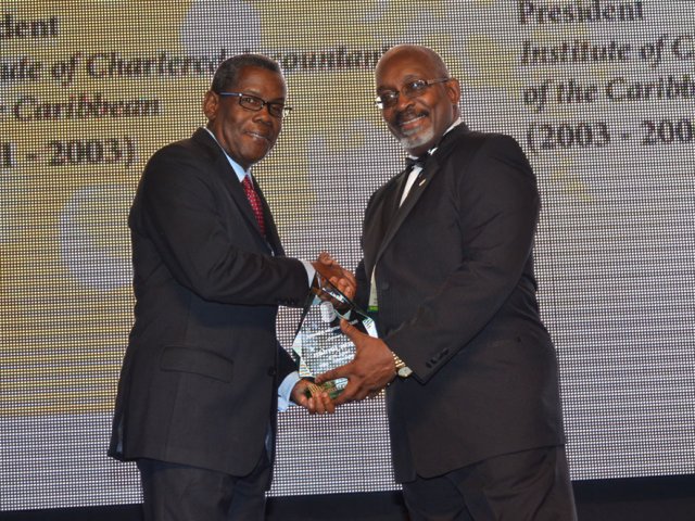 Elson Jordan accepts ICAC Recognition Award